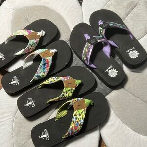 Two pair of Corkys and one pair of yellow box flip flops